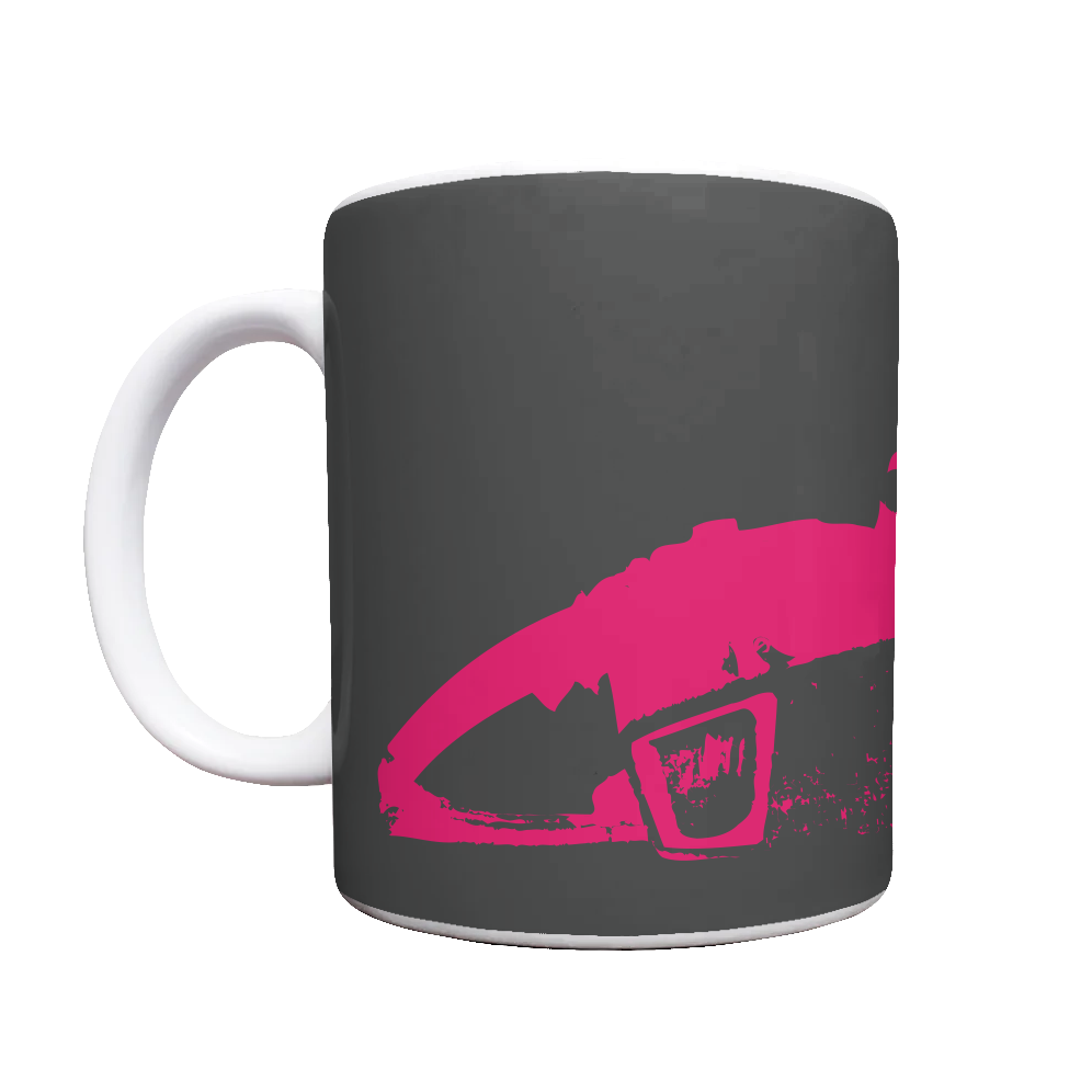 White mug with black background, MOTION CITY SOUNDTRACK in bold white lettering, pink chainsaw graphic.