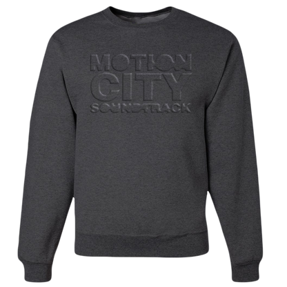 Dark grey crewneck with MOTION CITY SOUNDTRACK in embossed lettering on the chest