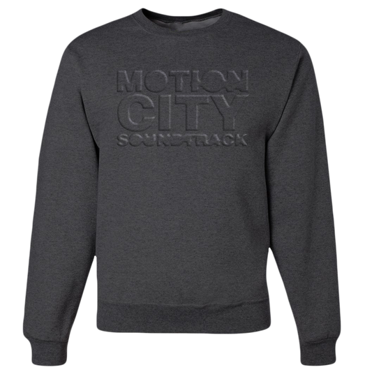 Dark grey crewneck with MOTION CITY SOUNDTRACK in embossed lettering on the chest