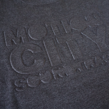 Dark grey crewneck with MOTION CITY SOUNDTRACK in embossed lettering on the chest